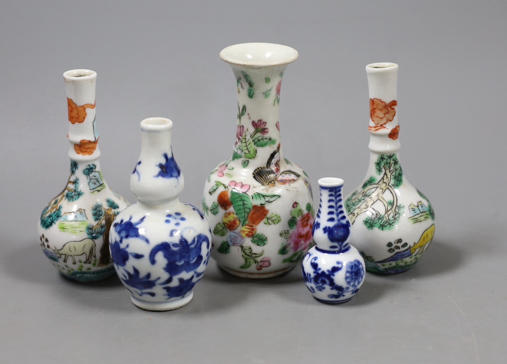 A group of Chinese miniature porcelain bottle vase, 19th/20th century and a Meissen miniature onion pattern vase. Tallest 12cm